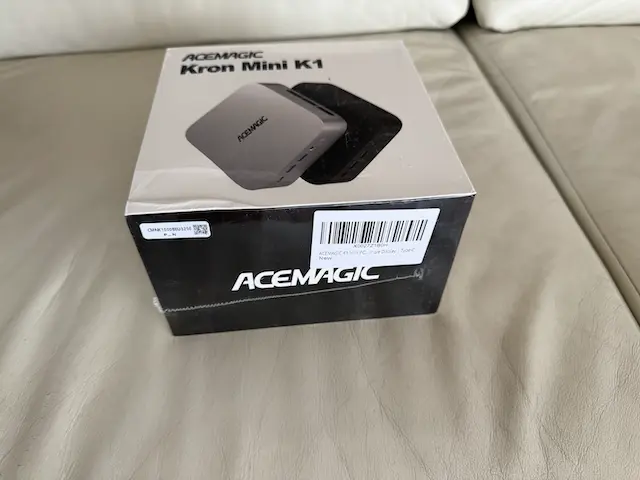 Retail packaging of the Acemagic K1 mini PC showing the device and branding