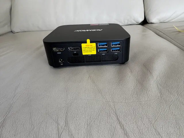 Rear ports of the Acemagic K1 mini PC including HDMI, DisplayPort, Ethernet, and multiple USB ports